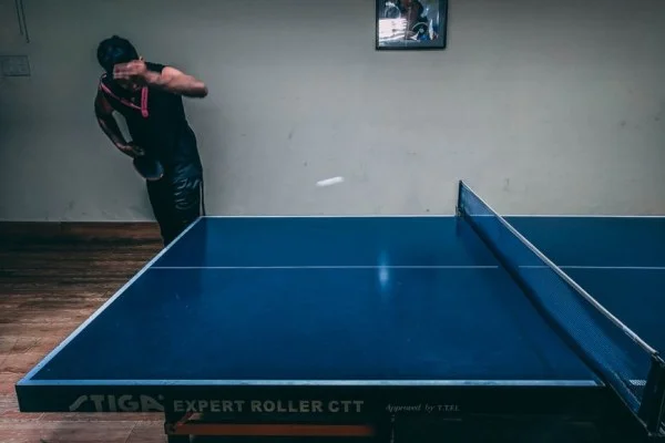 table tennis player serving